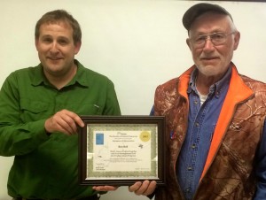 Tylar with MNR awards Ron Bell for years of participation with the  MNR Sports Fishery Angler Program